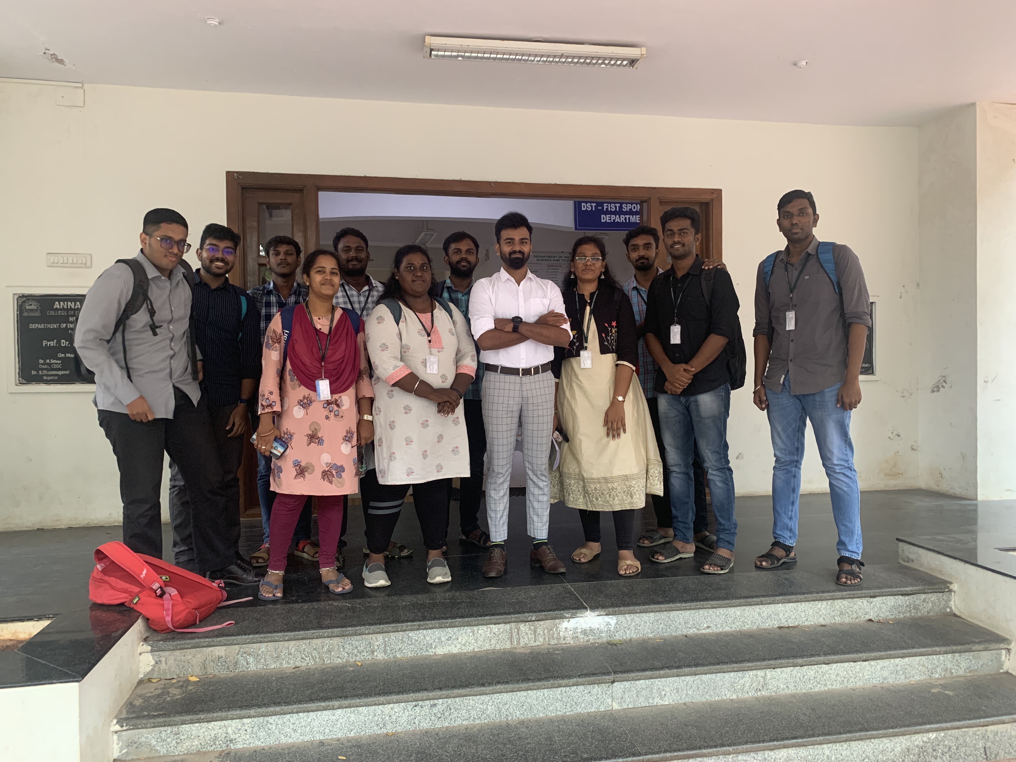 A TivinX mentor with a group of student interns outside their college department